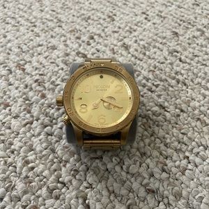 Gold large face NIXON watch